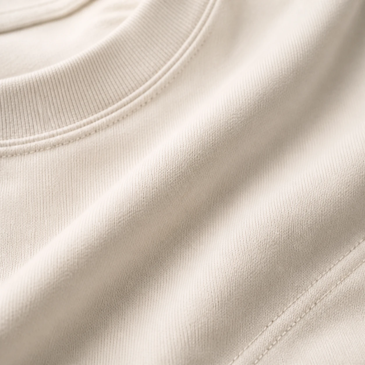 Macro view of the Flow Tee cotton jersey and tonal stitching